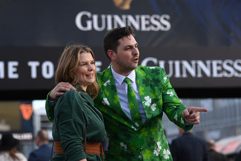CHELTENHAM, ENGLAND - MARCH 17: Irish themed spectators arrive on St Patrick's Day on day three of the Cheltenham Festival 2022 at Cheltenham Racecourse on March 17, 2022 in Cheltenham, England. (Photo by Mike Hewitt/Getty Images)