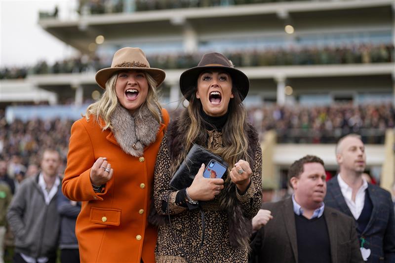 CHELTENHAM, ENGLAND - MARCH 17: Cheering on a winner on day three of The Festival at Cheltenham Racecourse on March 17, 2022 in Cheltenham, England. (Photo by Alan Crowhurst/Getty Images)