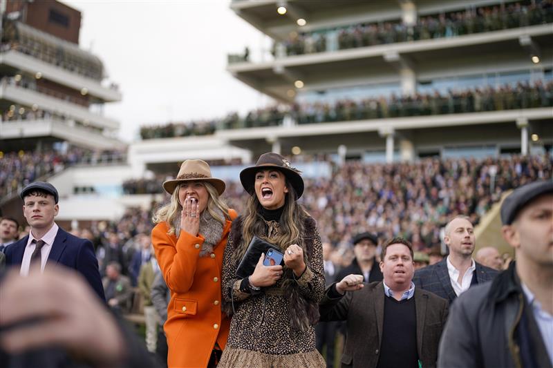 CHELTENHAM, ENGLAND - MARCH 17: Cheering on a winner on day three of The Festival at Cheltenham Racecourse on March 17, 2022 in Cheltenham, England. (Photo by Alan Crowhurst/Getty Images)