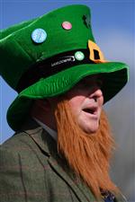 CHELTENHAM, ENGLAND - MARCH 17: An Irish themed spectator arrives on St Patrick's Day on day three of the Cheltenham Festival 2022 at Cheltenham Racecourse on March 17, 2022 in Cheltenham, England. (Photo by Mike Hewitt/Getty Images)