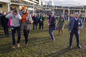 CHELTENHAM, ENGLAND - MARCH 17: Reactions from the winning connections of Love Envoi as they watch their horse on the big screen win The Ryanair Mares' Novices' Hurdleon day three of The Festival at Cheltenham Racecourse on March 17, 2022 in Cheltenham, England. (Photo by Alan Crowhurst/Getty Images)