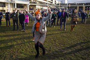 CHELTENHAM, ENGLAND - MARCH 17: Reactions from the winning connections of Love Envoi as they watch their horse on the big screen win The Ryanair Mares' Novices' Hurdleon day three of The Festival at Cheltenham Racecourse on March 17, 2022 in Cheltenham, England. (Photo by Alan Crowhurst/Getty Images)