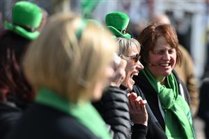 CHELTENHAM, ENGLAND - MARCH 17: Irish themed spectators arrive on St Patrick's Day on day three of the Cheltenham Festival 2022 at Cheltenham Racecourse on March 17, 2022 in Cheltenham, England. (Photo by Mike Hewitt/Getty Images)