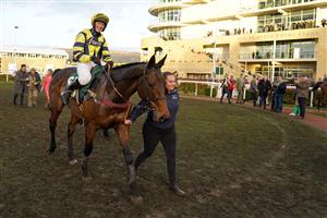 CHELTENHAM, ENGLAND - MARCH 17: Lucy Turner riding Chambardare led into the winners enclosure after victory in The Fulke Walwyn Kim Muir Challenge Cup Amateur Jockeys' Handicap Chase on day three of The Festival at Cheltenham Racecourse on March 17, 2022 in Cheltenham, England. (Photo by Alan Crowhurst/Getty Images)