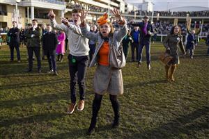 CHELTENHAM, ENGLAND - MARCH 17: Reactions from the winning connections of Love Envoi as they watch their horse on the big screen win The Ryanair Mares' Novices' Hurdleon day three of The Festival at Cheltenham Racecourse on March 17, 2022 in Cheltenham, England. (Photo by Alan Crowhurst/Getty Images)