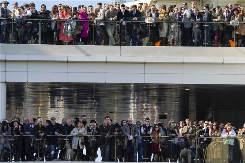 CHELTENHAM, ENGLAND - MARCH 18: Racegoers on day four of The Festival at Cheltenham Racecourse on March 18, 2022 in Cheltenham, England. (Photo by Alan Crowhurst/Getty Images)