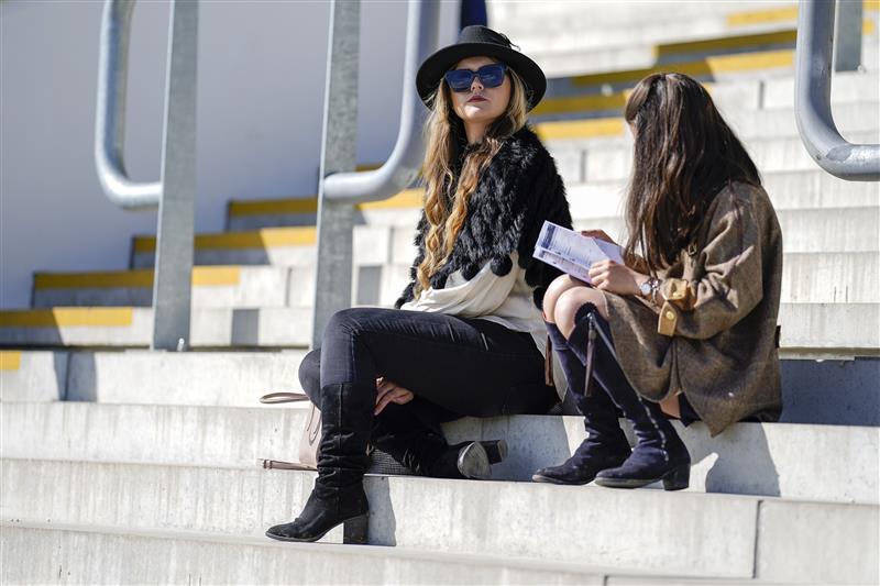 CHELTENHAM, ENGLAND - MARCH 18: Racegoers relax before the start of racing on day four of The Festival at Cheltenham Racecourse on March 18, 2022 in Cheltenham, England. (Photo by Alan Crowhurst/Getty Images)