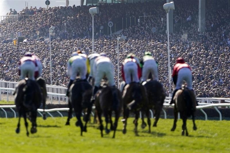 CHELTENHAM, ENGLAND - MARCH 18: Spectators are seen in the grandstand as they watch The Albert Bartlett Novices' Hurdle race during day four of the Cheltenham Festival 2022 at Cheltenham Racecourse on March 18, 2022 in Cheltenham, England. (Photo by Alan Crowhurst/Getty Images)