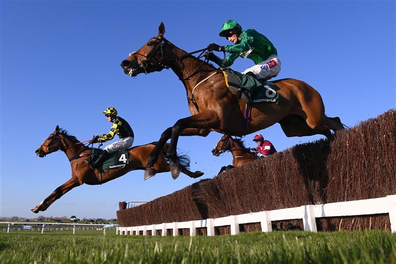 CHELTENHAM, ENGLAND - MARCH 18: Daniel Jacob and Zambella jump the third last with Sam Coltherd and Maid O'Malley (4) on day four of the Cheltenham Festival 2022 at Cheltenham Racecourse on March 18, 2022 in Cheltenham, England. (Photo by Mike Hewitt/Getty Images)
