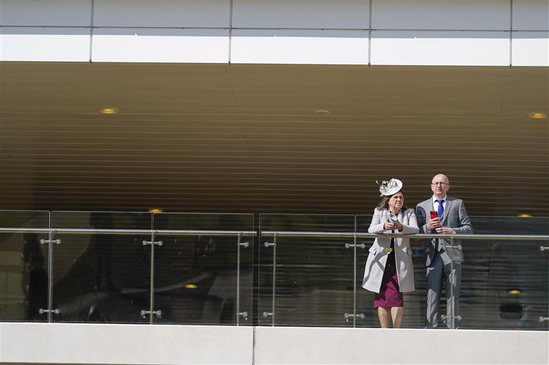 CHELTENHAM, ENGLAND - MARCH 18: Racegoers relax before the start of racing on day four of The Festival at Cheltenham Racecourse on March 18, 2022 in Cheltenham, England. (Photo by Alan Crowhurst/Getty Images)