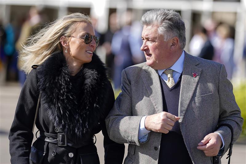 CHELTENHAM, ENGLAND - MARCH 18: Trainer Paul Nicholls and guest arrive at the track on day four of The Festival at Cheltenham Racecourse on March 18, 2022 in Cheltenham, England. (Photo by Alan Crowhurst/Getty Images)