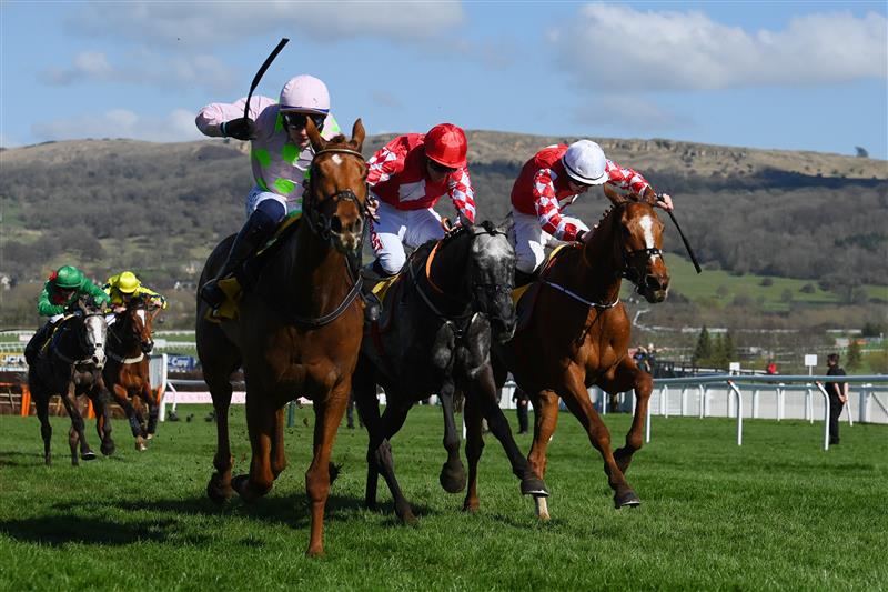 CHELTENHAM, ENGLAND - MARCH 18: Paul Townend on Vauban (L, pink kit) approach the finish line before Jack Kennedy (R, white cap) on Pied Piper to win The JCB Triumph Hurdle race during day four of the Cheltenham Festival 2022 at Cheltenham Racecourse on March 18, 2022 in Cheltenham, England. (Photo by Mike Hewitt/Getty Images)