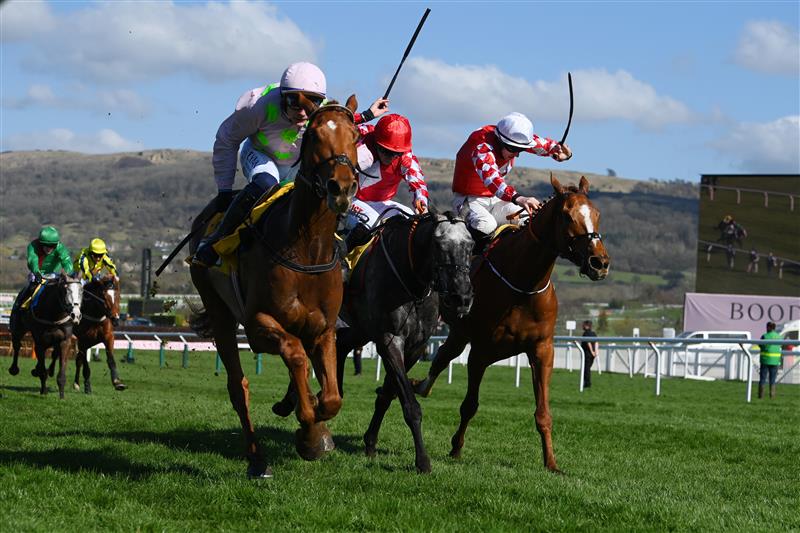 CHELTENHAM, ENGLAND - MARCH 18: Paul Townend on Vauban (L, pink kit) approach the finish line before Jack Kennedy (R, white cap) on Pied Piper to win The JCB Triumph Hurdle race during day four of the Cheltenham Festival 2022 at Cheltenham Racecourse on March 18, 2022 in Cheltenham, England. (Photo by Mike Hewitt/Getty Images)