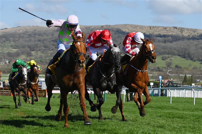 CHELTENHAM, ENGLAND - MARCH 18: Paul Townend on Vauban (L, pink kit) approach the finish line before Jack Kennedy (R, white cap) on Pied Piper to win The JCB Triumph Hurdle race during day four of the Cheltenham Festival 2022 at Cheltenham Racecourse on March 18, 2022 in Cheltenham, England. (Photo by Mike Hewitt/Getty Images)