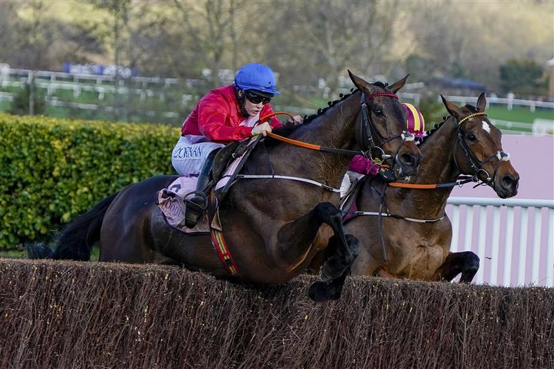 CHELTENHAM, ENGLAND - MARCH 18: Rachael Blackmore riding A Plus Tard (red) clear the last to win The Boodles Cheltenham Gold Cup Chase on day four of The Festival at Cheltenham Racecourse on March 18, 2022 in Cheltenham, England. (Photo by Alan Crowhurst/Getty Images)