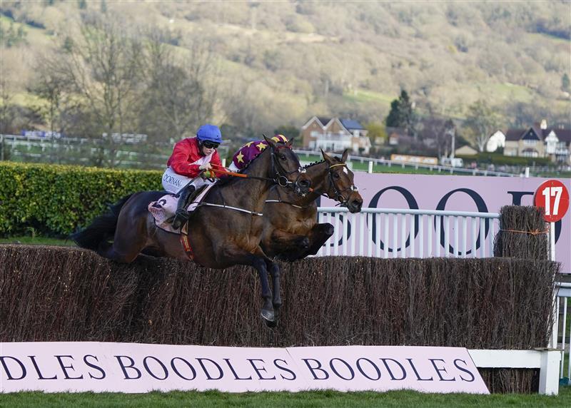 CHELTENHAM, ENGLAND - MARCH 18: Rachael Blackmore riding A Plus Tard (red) clear the last to win The Boodles Cheltenham Gold Cup Chase on day four of The Festival at Cheltenham Racecourse on March 18, 2022 in Cheltenham, England. (Photo by Alan Crowhurst/Getty Images)