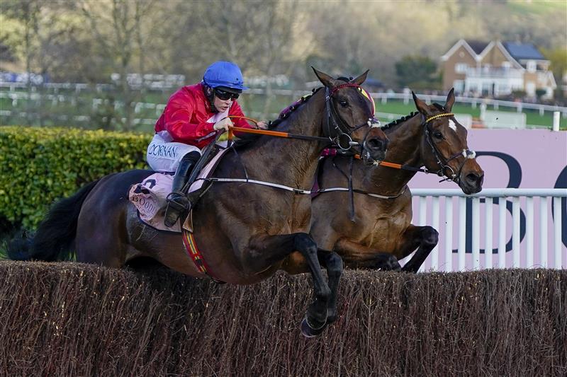 CHELTENHAM, ENGLAND - MARCH 18: Rachael Blackmore riding A Plus Tard (red) clear the last to win The Boodles Cheltenham Gold Cup Chase on day four of The Festival at Cheltenham Racecourse on March 18, 2022 in Cheltenham, England. (Photo by Alan Crowhurst/Getty Images)