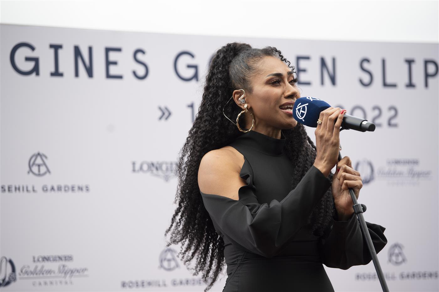SYDNEY, AUSTRALIA - MARCH 19: Paulini sings the national anthem during Longines Golden Slipper Day Rosehill Gardens on March 19, 2022 in Sydney, Australia. (Photo by Wendell Teodoro/Getty Images for ATC)