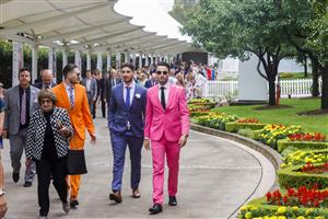 SYDNEY, AUSTRALIA - MARCH 19: Racegoers arrive at the track for the Sydney Racing Longines Golden Slipper Day, at Rosehill Gardens on March 19, 2022 in Sydney, Australia. (Photo by Jenny Evans/Getty Images)