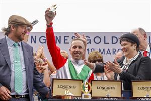 SYDNEY, AUSTRALIA - MARCH 19: Brenton Avdulla holds up his trophy after winning race 8 the Longines Golden Slipper on Fireburn during Sydney Racing Longines Golden Slipper Day, at Rosehill Gardens on March 19, 2022 in Sydney, Australia. (Photo by Jenny Evans/Getty Images)