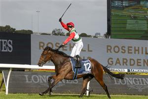 SYDNEY, AUSTRALIA - MARCH 19: Brenton Avdulla on Fireburn wins race 8 the Longines Golden Slipper during Sydney Racing Longines Golden Slipper Day, at Rosehill Gardens on March 19, 2022 in Sydney, Australia. (Photo by Jenny Evans/Getty Images)