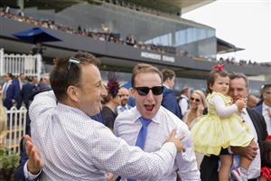 SYDNEY, AUSTRALIA - MARCH 19: Winning connections of Forbidden Love cheer after race 7 The Agency George Ryder Stakes during Sydney Racing Longines Golden Slipper Day, at Rosehill Gardens on March 19, 2022 in Sydney, Australia. (Photo by Jenny Evans/Getty Images)