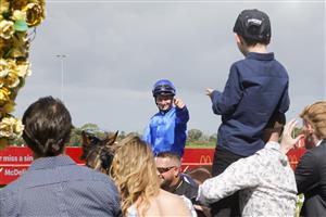 SYDNEY, AUSTRALIA - MARCH 19: James McDonald on Anamoe points to the crowd after winning race 6 the Sky Racing Active Rosehill Guineas during Sydney Racing Longines Golden Slipper Day, at Rosehill Gardens on March 19, 2022 in Sydney, Australia. (Photo by Jenny Evans/Getty Images)