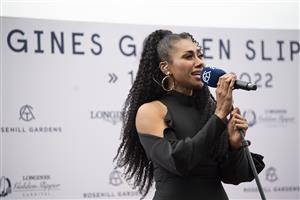 SYDNEY, AUSTRALIA - MARCH 19: Paulini sings the national anthem during Longines Golden Slipper Day Rosehill Gardens on March 19, 2022 in Sydney, Australia. (Photo by Wendell Teodoro/Getty Images for ATC)