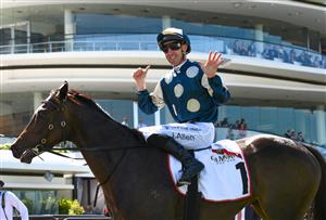 MELBOURNE, AUSTRALIA - MARCH 19: John Allen riding Yonce after winning sixth straight race in Race 3, the The G.h. Mumm Mystic Journey, during All-Star Mile Race day at Flemington Racecourse on March 19, 2022 in Melbourne, Australia. (Photo by Vince Caligiuri/Getty Images)