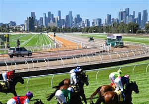MELBOURNE, AUSTRALIA - MARCH 19: Rhys McLeod riding Express Pass (front R)winning Race 2, the Vobis Gold Comet, during All-Star Mile Race day at Flemington Racecourse on March 19, 2022 in Melbourne, Australia. (Photo by Vince Caligiuri/Getty Images)