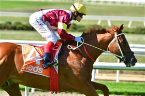 MELBOURNE, AUSTRALIA - MARCH 26: Craig Williams riding Crystal Pegasus winning Race 6, the Neds Mornington Cup, during Mornington Cup Day at Mornington Racecourse on March 26, 2022 in Melbourne, Australia. (Photo by Vince Caligiuri/Getty Images)