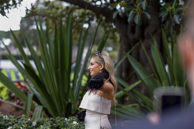 SYDNEY, AUSTRALIA - APRIL 02: A woman poses for a phone photo during The Star Championships Day 1 at Royal Randwick Racecourse on April 02, 2022 in Sydney, Australia. The Championships race days are the highlight of the Sydney Autumn Racing Carnival. The Championships Day 1 features four Group 1 events headlined by the $3 million Doncaster Mile and $2 million Australian Derby. (Photo by Jenny Evans/Getty Images)