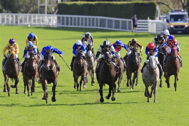 SYDNEY, AUSTRALIA - APRIL 02: John Allen on Hitotsu (pale blue and yellow) wins race 7 the Bentley Australian Derby during The Star Championships Day 1 at Royal Randwick Racecourse on April 02, 2022 in Sydney, Australia. (Photo by Mark Evans/Getty Images)
