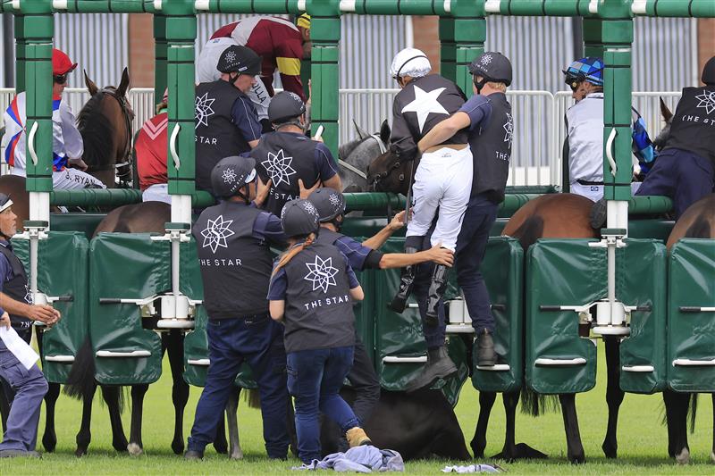 SYDNEY, AUSTRALIA - APRIL 02: Tim Clark is helped off the mount of Summerbeel who was scratched at the start of race 3 the TAB Adrian Knox Stakes during The Star Championships Day 1 at Royal Randwick Racecourse on April 02, 2022 in Sydney, Australia. (Photo by Mark Evans/Getty Images)