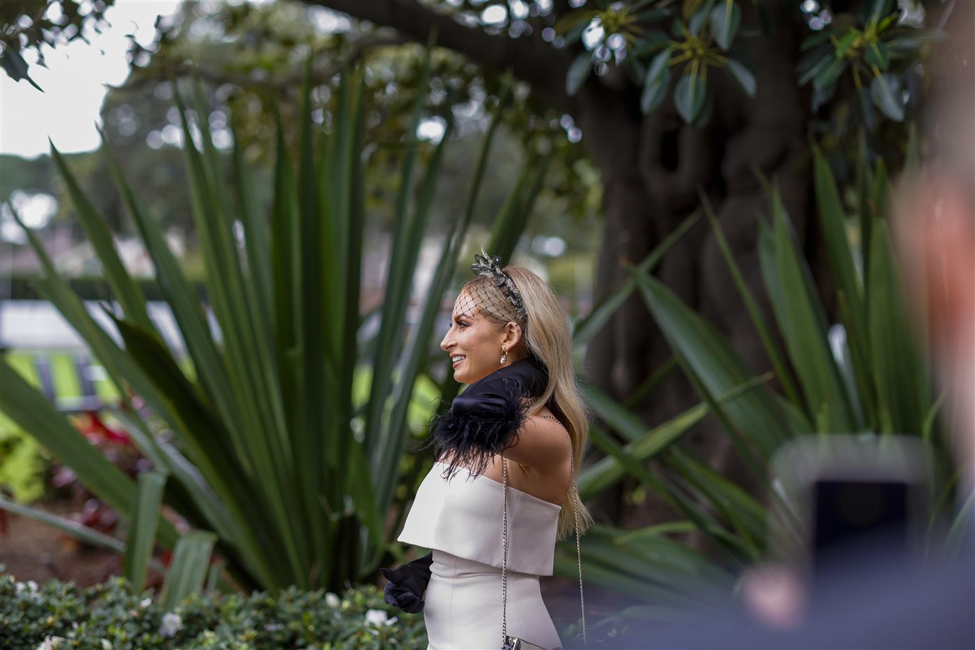 SYDNEY, AUSTRALIA - APRIL 02: A woman poses for a phone photo during The Star Championships Day 1 at Royal Randwick Racecourse on April 02, 2022 in Sydney, Australia. The Championships race days are the highlight of the Sydney Autumn Racing Carnival. The Championships Day 1 features four Group 1 events headlined by the $3 million Doncaster Mile and $2 million Australian Derby. (Photo by Jenny Evans/Getty Images)