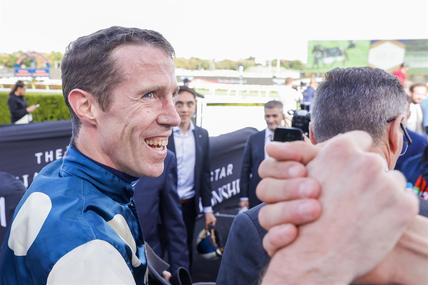SYDNEY, AUSTRALIA - APRIL 02: John Allen is congratulated after winning race 7 the Bentley Australian Derby on Hitotsu during The Star Championships Day 1 at Royal Randwick Racecourse on April 02, 2022 in Sydney, Australia. (Photo by Jenny Evans/Getty Images)
