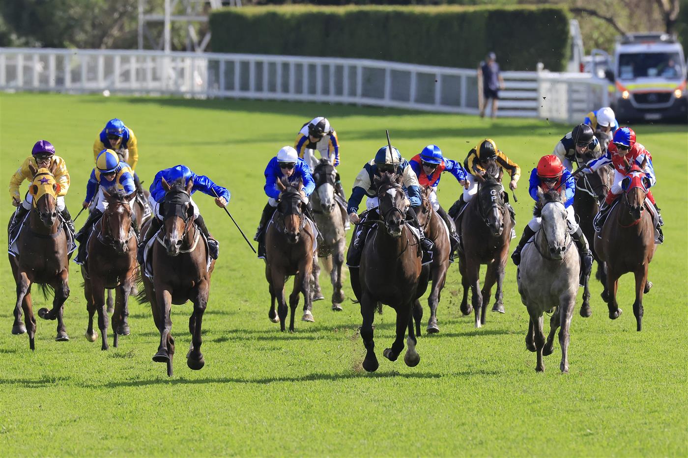 SYDNEY, AUSTRALIA - APRIL 02: John Allen on Hitotsu (pale blue and yellow) wins race 7 the Bentley Australian Derby during The Star Championships Day 1 at Royal Randwick Racecourse on April 02, 2022 in Sydney, Australia. (Photo by Mark Evans/Getty Images)
