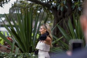 SYDNEY, AUSTRALIA - APRIL 02: A woman poses for a phone photo during The Star Championships Day 1 at Royal Randwick Racecourse on April 02, 2022 in Sydney, Australia. The Championships race days are the highlight of the Sydney Autumn Racing Carnival. The Championships Day 1 features four Group 1 events headlined by the $3 million Doncaster Mile and $2 million Australian Derby. (Photo by Jenny Evans/Getty Images)