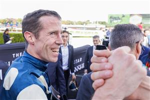 SYDNEY, AUSTRALIA - APRIL 02: John Allen is congratulated after winning race 7 the Bentley Australian Derby on Hitotsu during The Star Championships Day 1 at Royal Randwick Racecourse on April 02, 2022 in Sydney, Australia. (Photo by Jenny Evans/Getty Images)