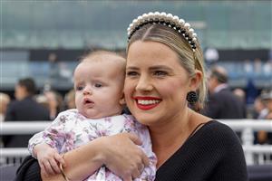 SYDNEY, AUSTRALIA - APRIL 02: Taylor Avdulla and baby Bella Avdulla look on after husband Brenton Avdulla won race 6 the Inglis Sires during The Star Championships Day 1 at Royal Randwick Racecourse on April 02, 2022 in Sydney, Australia. (Getty)
