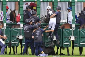 SYDNEY, AUSTRALIA - APRIL 02: Tim Clark is helped off the mount of Summerbeel who was scratched at the start of race 3 the TAB Adrian Knox Stakes during The Star Championships Day 1 at Royal Randwick Racecourse on April 02, 2022 in Sydney, Australia. (Photo by Mark Evans/Getty Images)