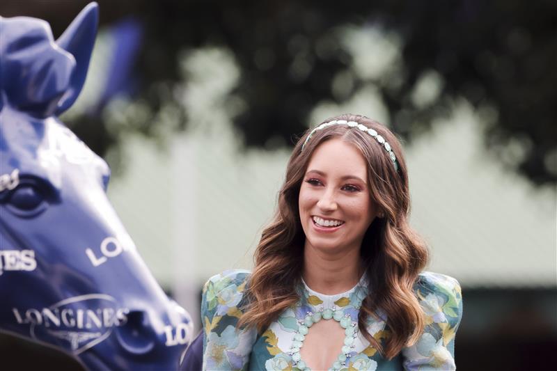 SYDNEY, AUSTRALIA - APRIL 09: Katelyn Mallyon looks at the Longines horse duringThe Championships Day 2, Longines Queen Elizabeth Stakes Day at Royal Randwick Racecourse on April 09, 2022 in Sydney, Australia. The Championships race days are the highlight of the Sydney Autumn Racing Carnival. (Photo by Jenny Evans/Getty Images)
