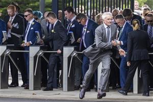 SYDNEY, AUSTRALIA - APRIL 09: People race through the turnstiles as they open ahead of of The Championships Day 2, Longines Queen Elizabeth Stakes Day at Royal Randwick Racecourse on April 09, 2022 in Sydney, Australia. The Championships race days are the highlight of the Sydney Autumn Racing Carnival. (Photo by Jenny Evans/Getty Images)