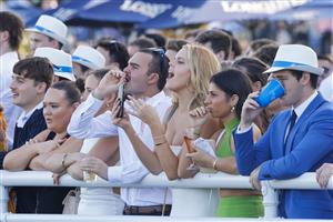 SYDNEY, AUSTRALIA - APRIL 09: Racegoers cheer on the horses for race 6 The Star Australian Oaks during The Championships Day 2, Longines Queen Elizabeth Stakes Day, at Royal Randwick Racecourse on April 09, 2022 in Sydney, Australia. (Photo by Jenny Evans/Getty Images)