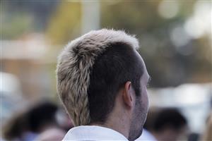 SYDNEY, AUSTRALIA - APRIL 09: A racegoer is seen with a mullet hair style during The Championships Day 2, Longines Queen Elizabeth Stakes Day at Royal Randwick Racecourse on April 09, 2022 in Sydney, Australia. The Championships race days are the highlight of the Sydney Autumn Racing Carnival. (Photo by Jenny Evans/Getty Images)