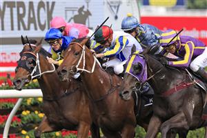 SYDNEY, AUSTRALIA - APRIL 09: Nash Rawiller on Kinloch (green/red cap) wins race 3 the Polytrack Provincial-Midway Championships Final during The Championships Day 2, Longines Queen Elizabeth Stakes Day, at Royal Randwick Racecourse on April 09, 2022 in Sydney, Australia. (Photo by Mark Evans/Getty Images)