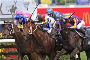 SYDNEY, AUSTRALIA - APRIL 09: Nash Rawiller on Kinloch (green/red cap) wins race 3 the Polytrack Provincial-Midway Championships Final during The Championships Day 2, Longines Queen Elizabeth Stakes Day, at Royal Randwick Racecourse on April 09, 2022 in Sydney, Australia. (Photo by Mark Evans/Getty Images)