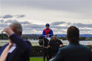 HAWKESBURY, AUSTRALIA - APRIL 30: Tommy Berry on Sacrimony returns to scale after winning race 5 the Living Turf Bm78 Handicap during Hawkesbury Cup Day at Hawkesbury Race Club on April 30, 2022 in Hawkesbury, Australia. (Photo by Jenny Evans/Getty Images)