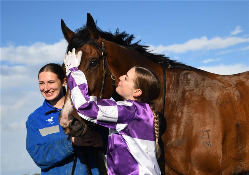 WARRNAMBOOL, AUSTRALIA - MAY 04: Madison Lloyd poses after riding Frankie Pinot to win Race 8,  the The Midfield Group Wangoom Handicap, during Galleywood Hurdle day at Warrnambool Racing Club on May 04, 2022 in Warrnambool, Australia. (Photo by Vince Caligiuri/Getty Images)