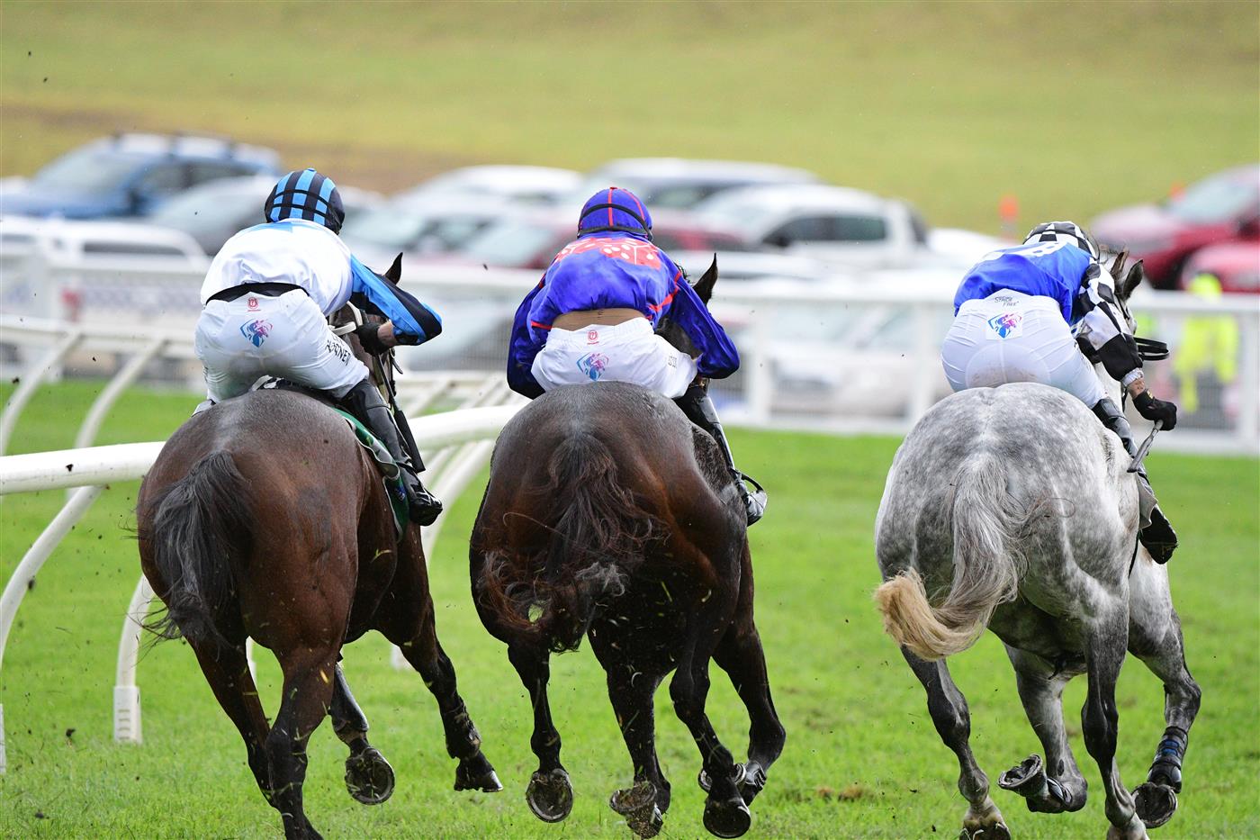WARRNAMBOOL, AUSTRALIA - MAY 04: Steven Pateman riding Saunter Boy (r) races to win from Will Gordon riding St Arnicca and Lee Horner riding Out and Dreaming (L) before winning Race 6, the Sovereign Resort Galleywood Hurdle, during Galleywood Hurdle day at Warrnambool Racing Club on May 04, 2022 in Warrnambool, Australia. (Photo by Vince Caligiuri/Getty Images)